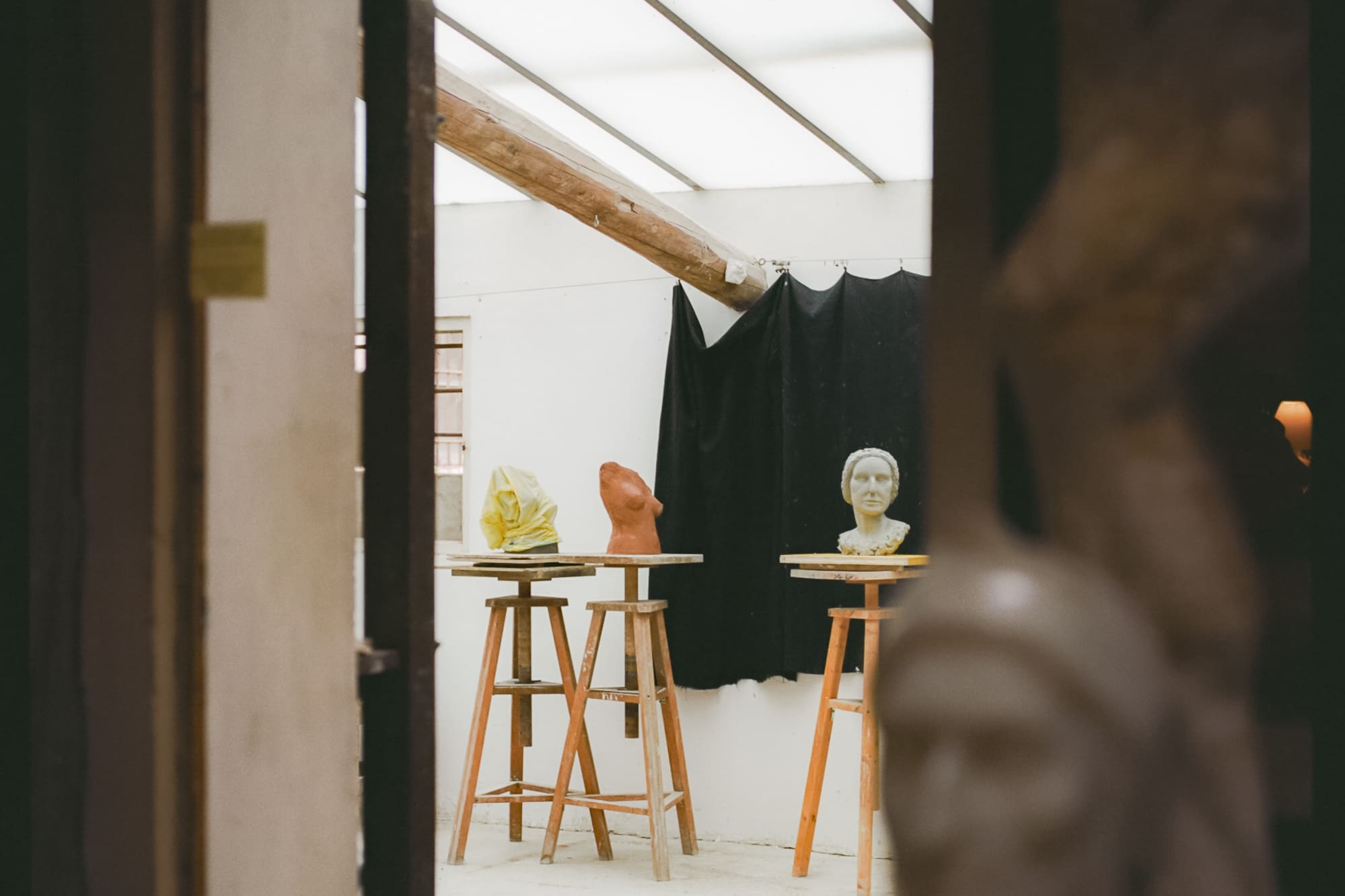 a room with statues and a door