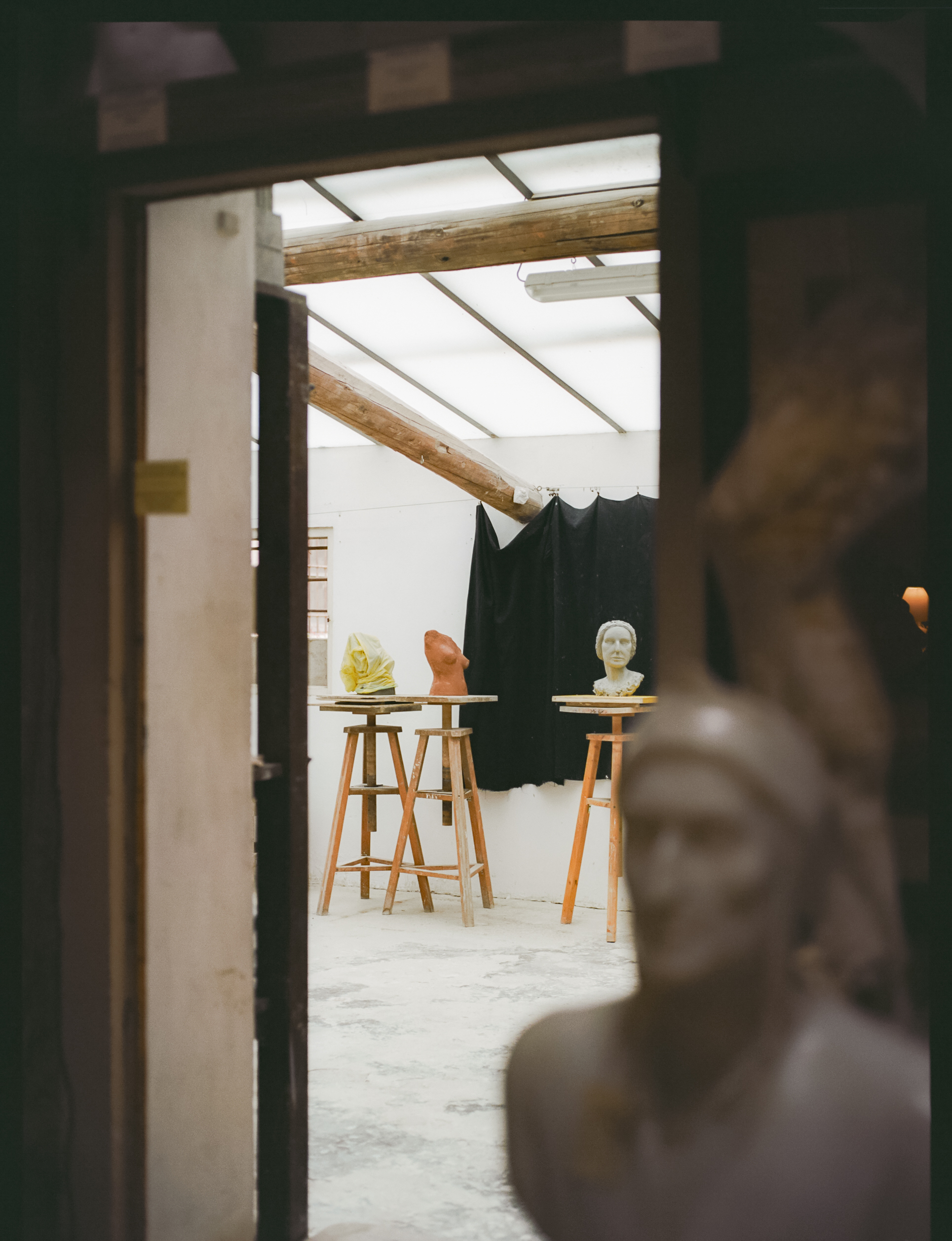 a room with statues and a door