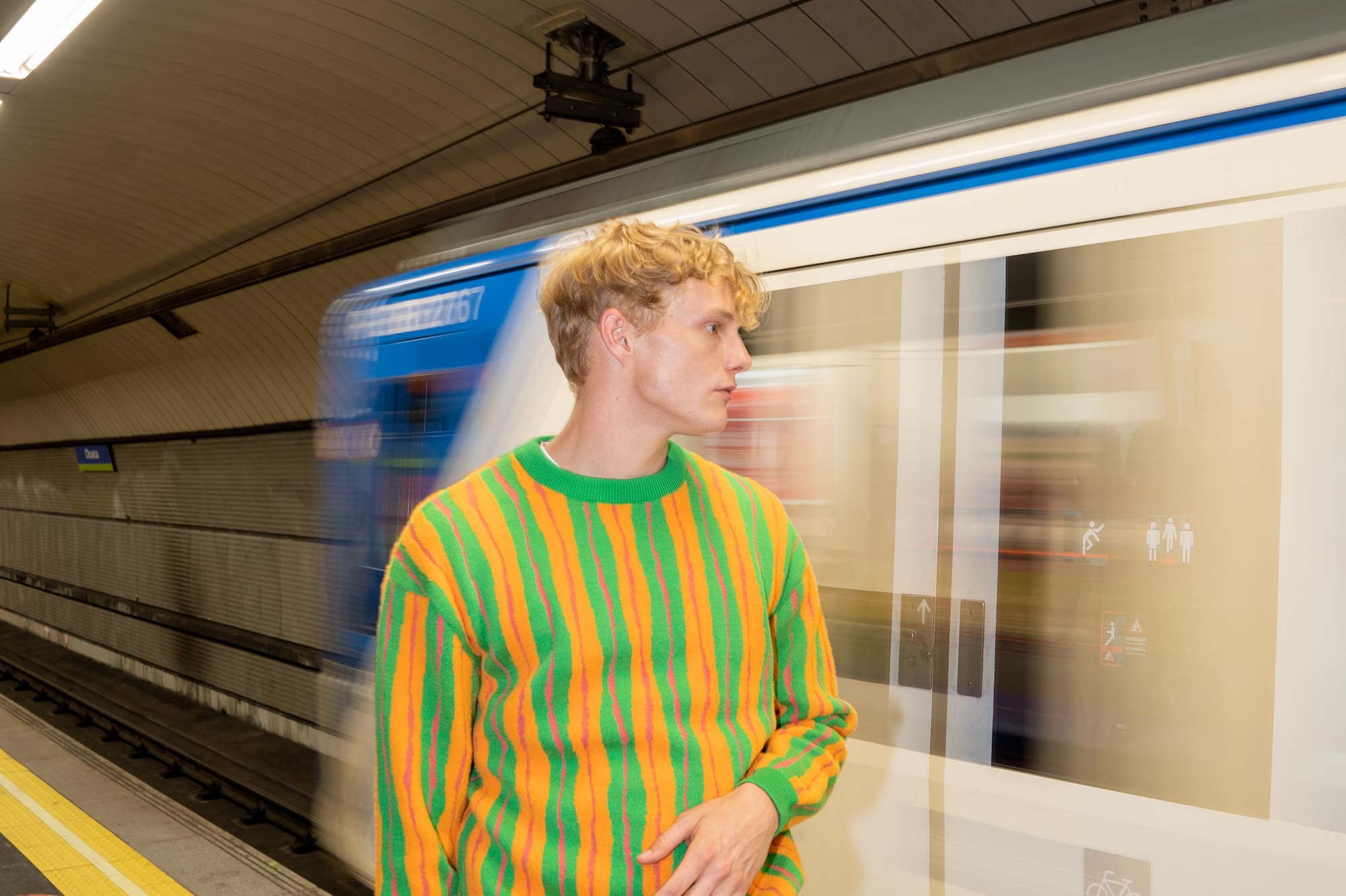 a man standing in a subway station
