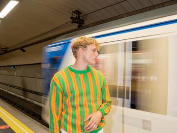 a man standing in a subway station