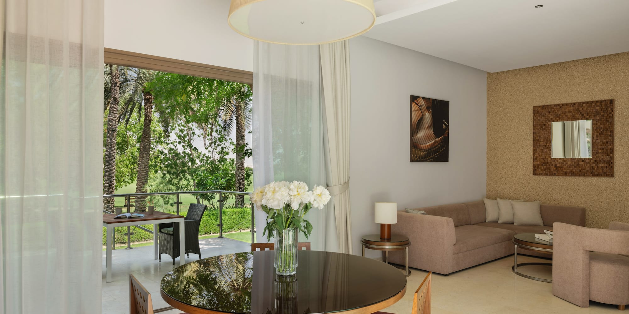 a living room with a table and chairs