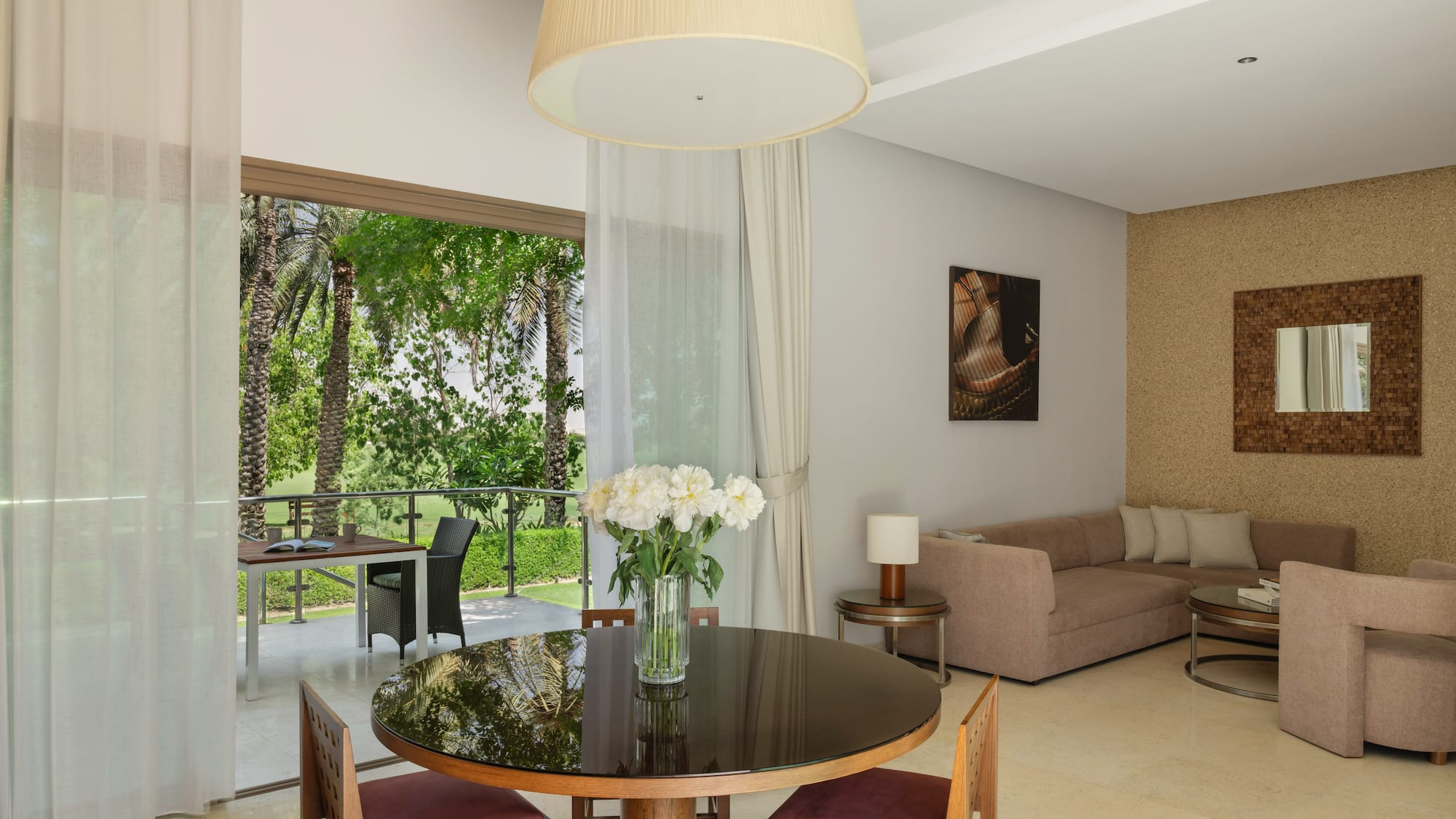 a living room with a table and chairs