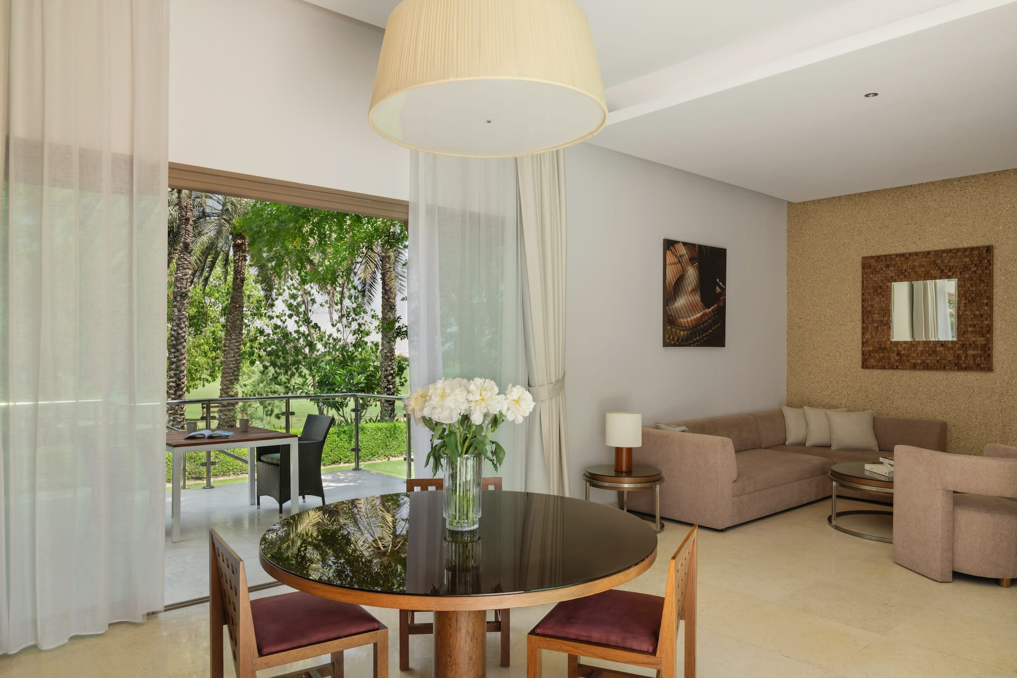 a living room with a table and chairs