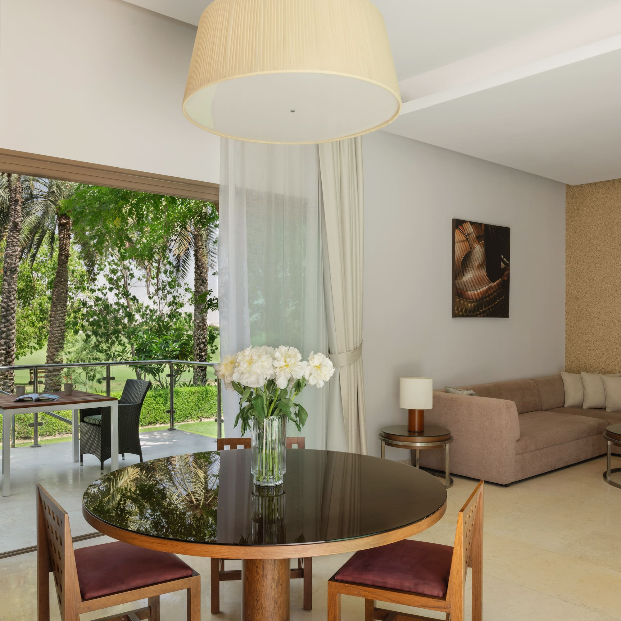 a living room with a table and chairs