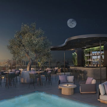 a rooftop bar with a pool and tables and chairs