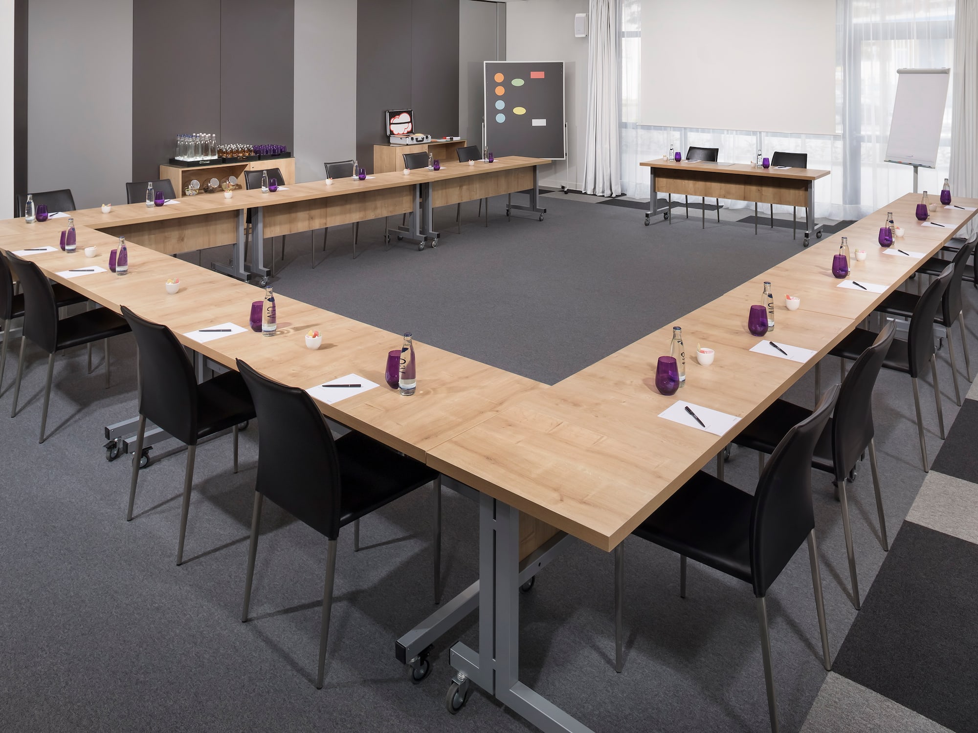 a conference room with a table and chairs