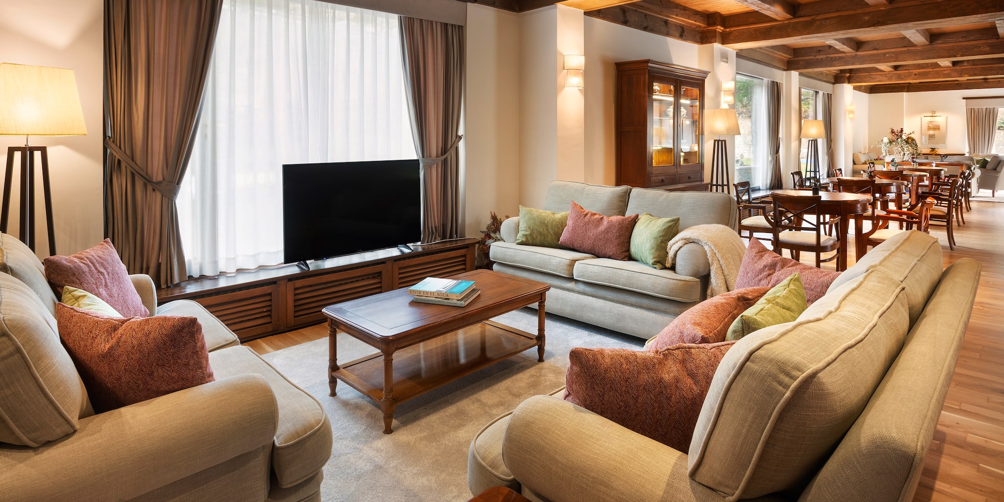 a living room with couches and a tv