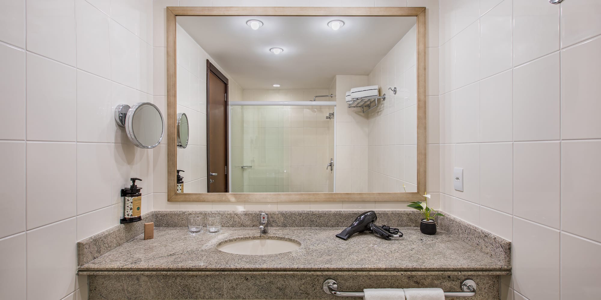 a bathroom with a mirror and a sink