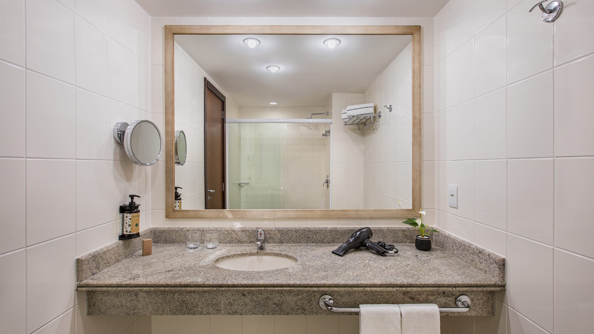 a bathroom with a mirror and a sink