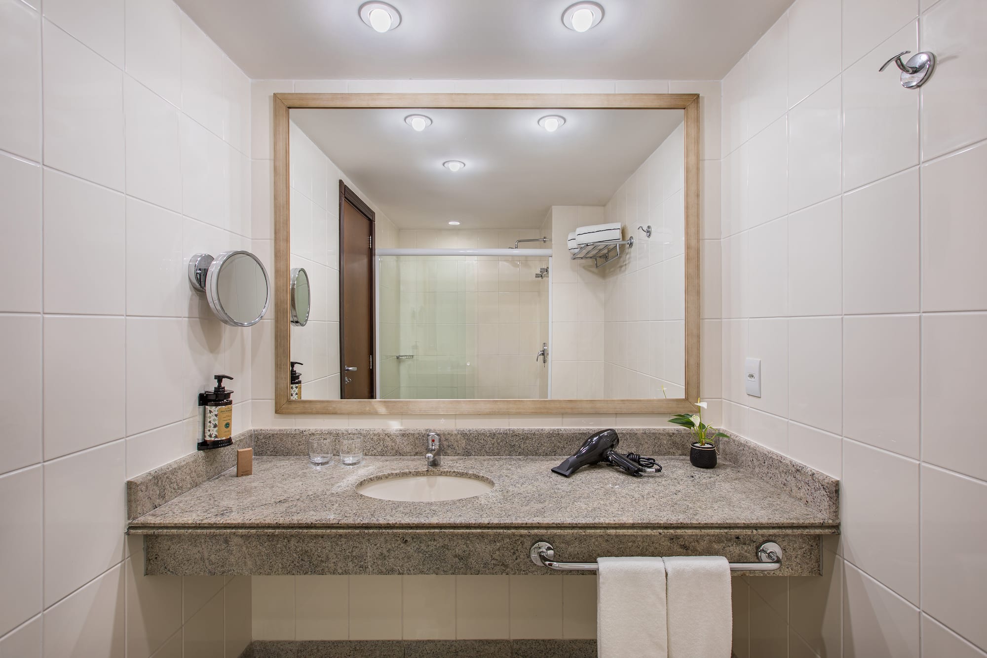 a bathroom with a mirror and a sink