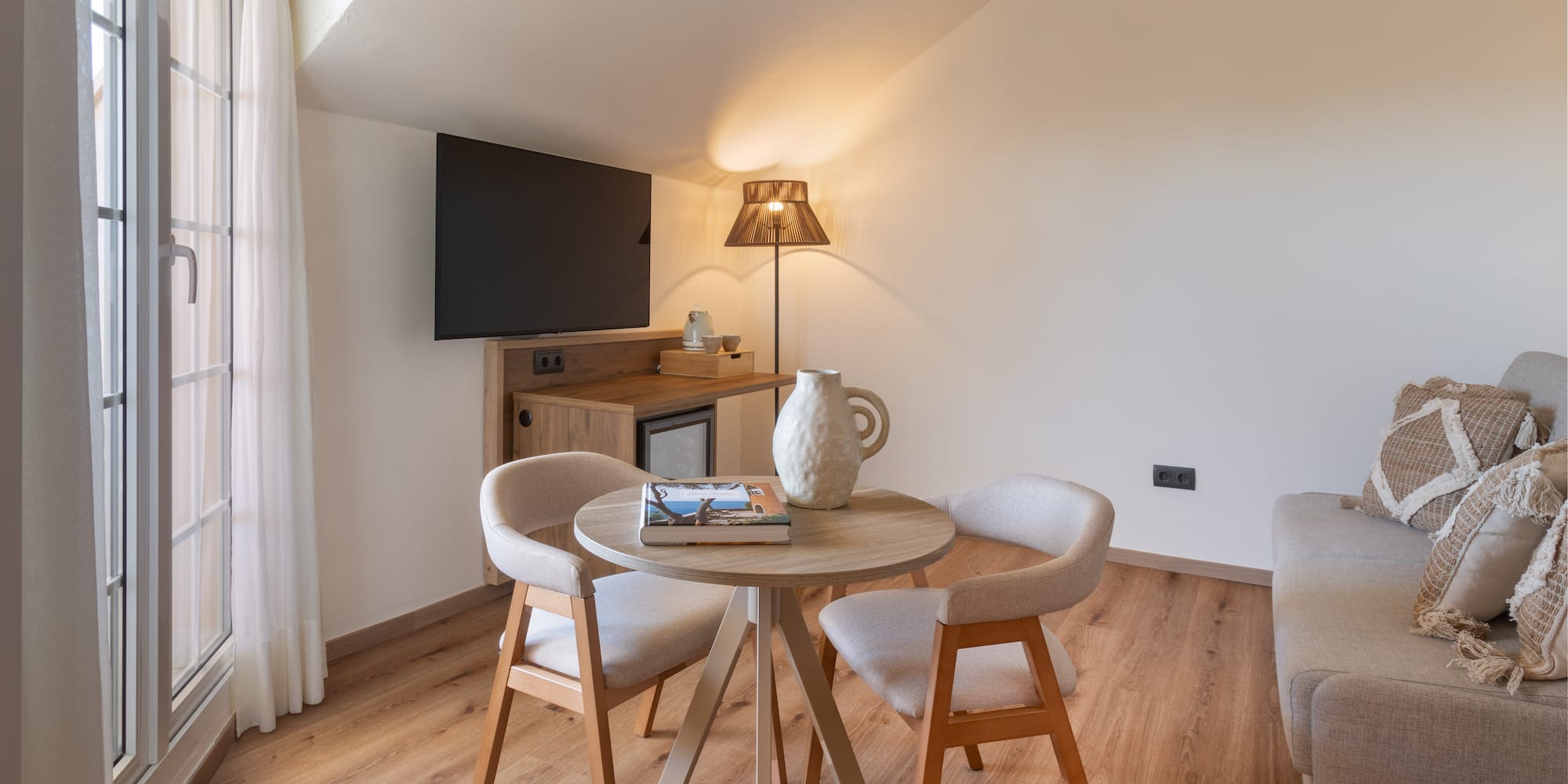 a room with a table and chairs