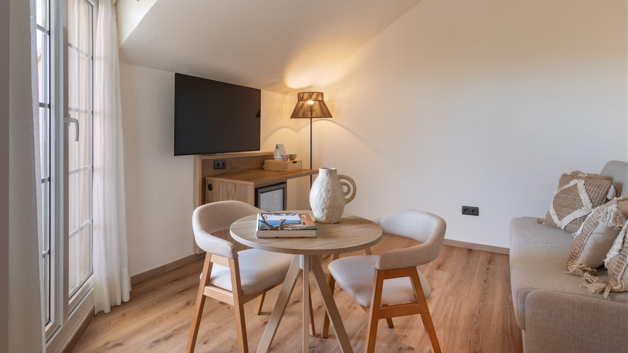 a room with a table and chairs