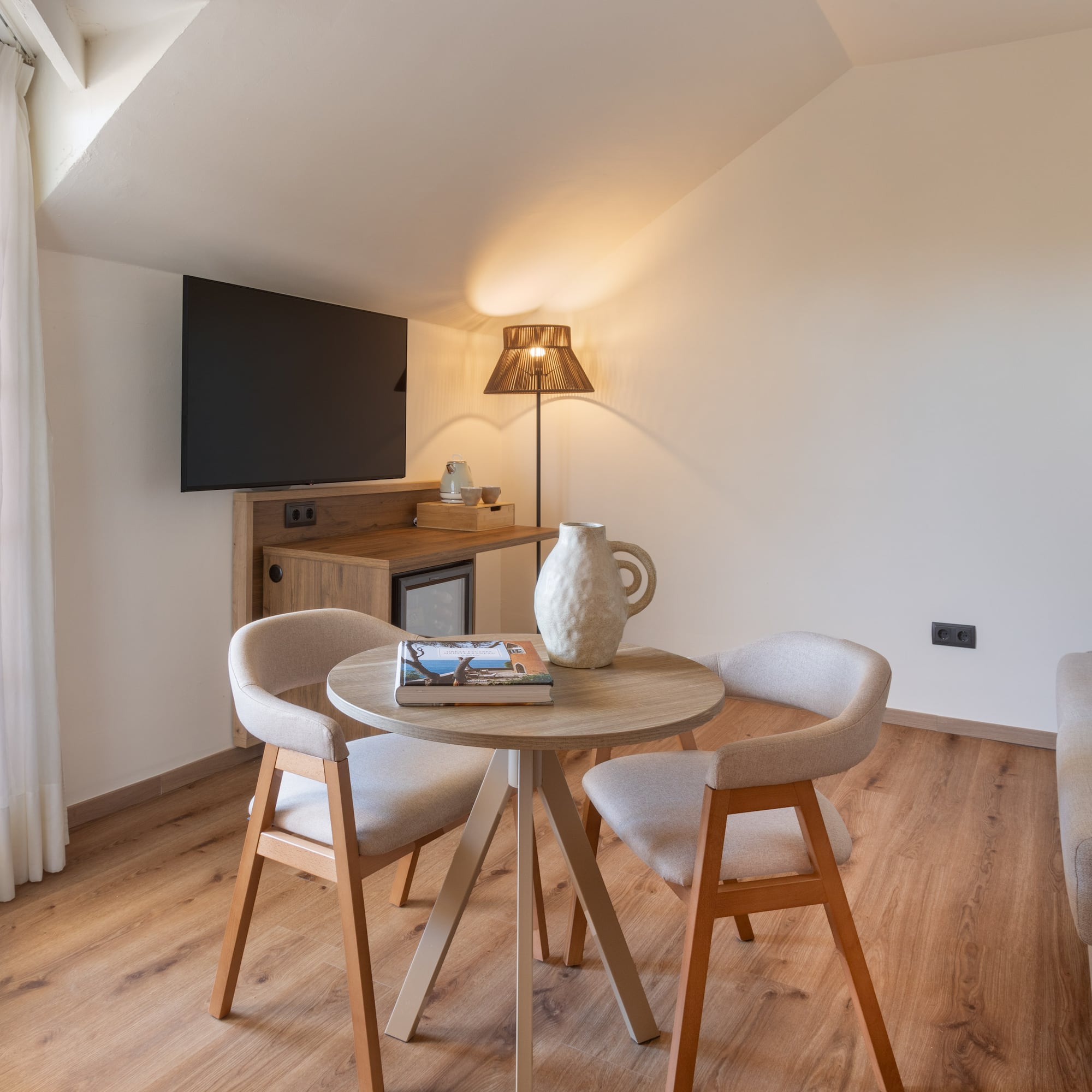 a room with a table and chairs