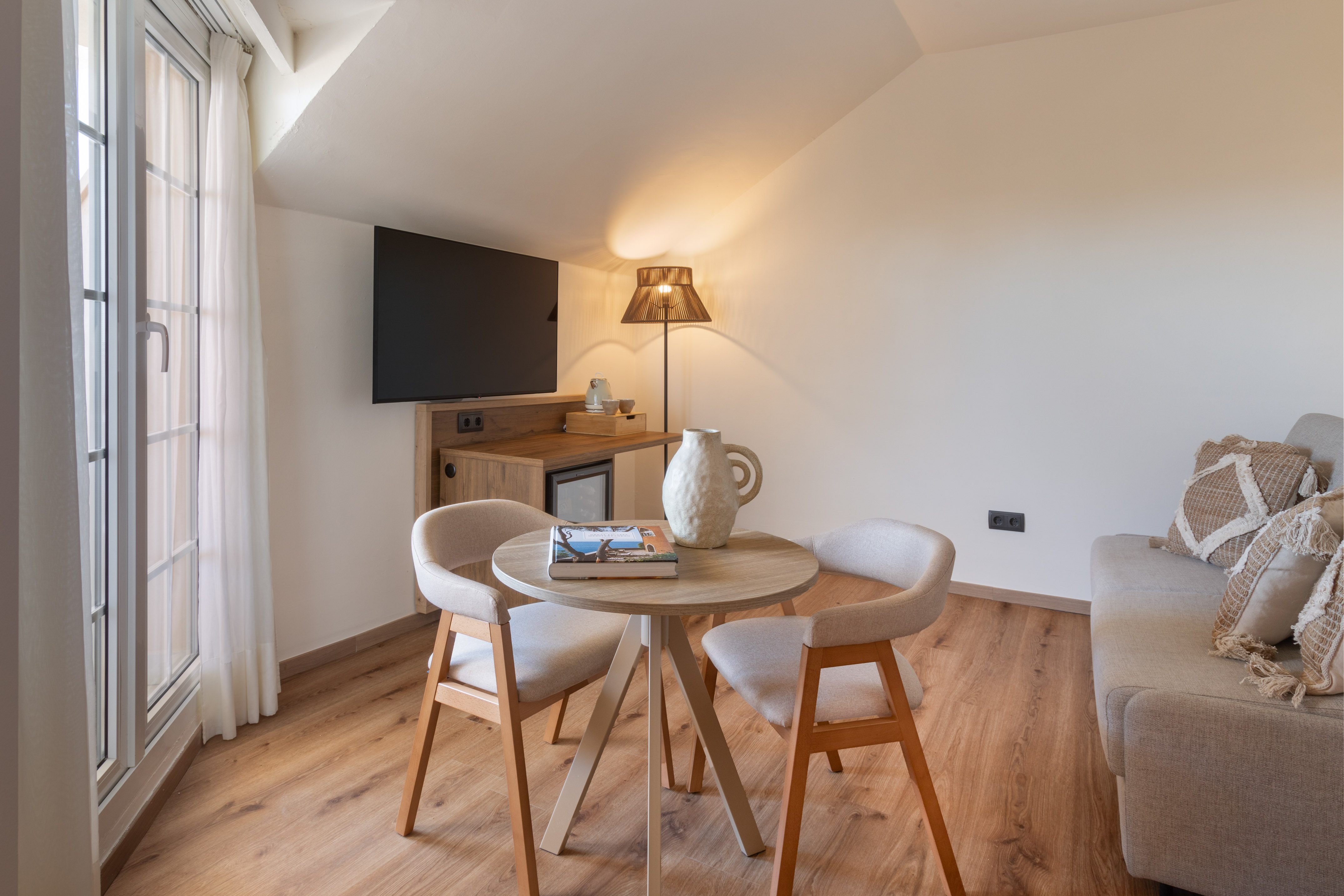 a room with a table and chairs