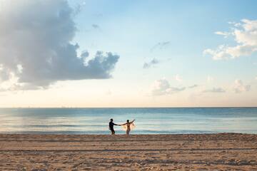 a man and woman on a beach