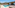 Modern hotel suite with private pool, sunbeds, and ocean view patio.