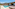 Modern hotel suite with private pool, sunbeds, and ocean view patio.