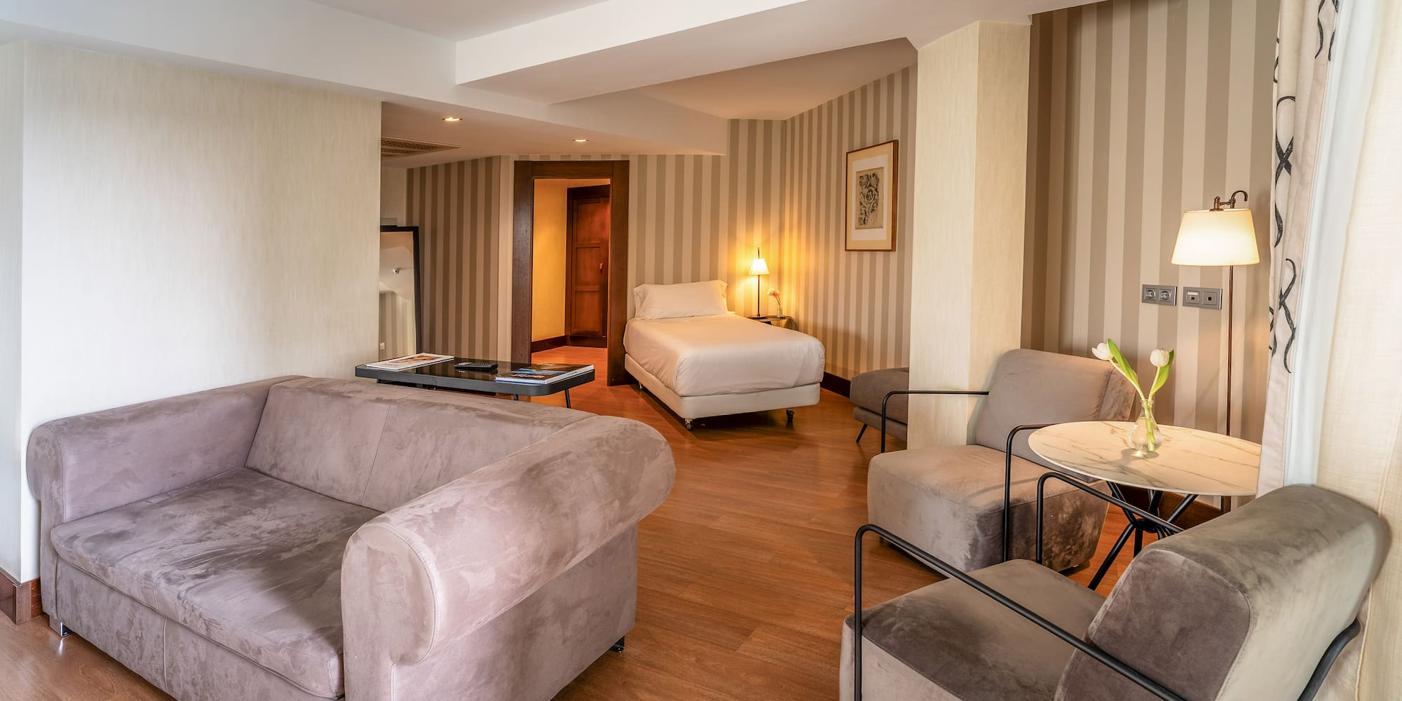 a room with couches and a bed