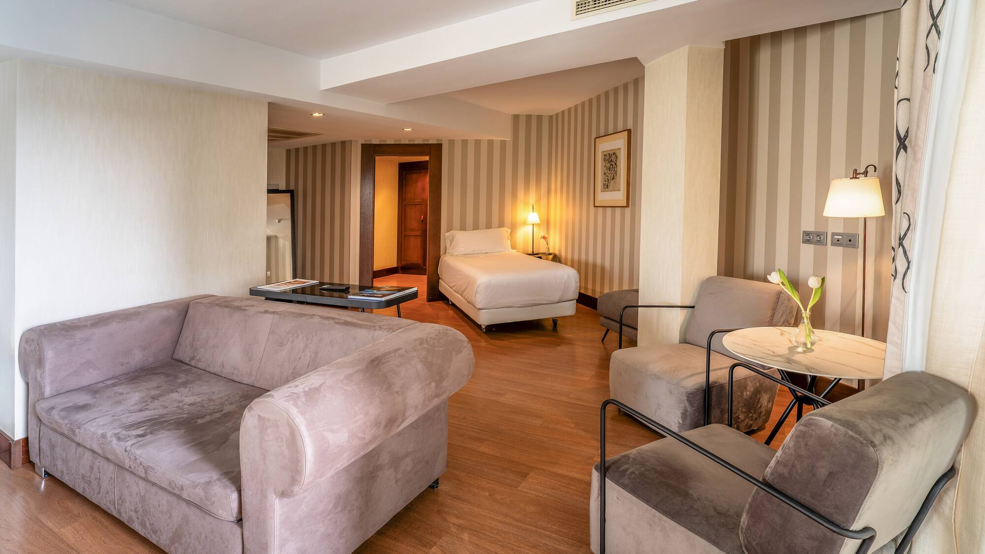 a room with couches and a bed