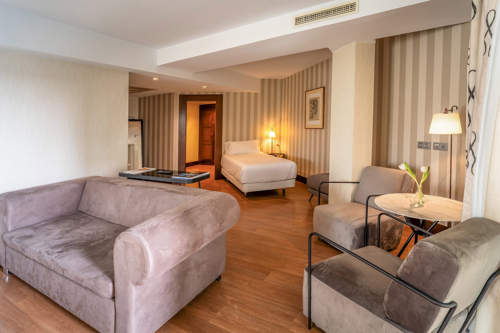 a room with couches and a bed