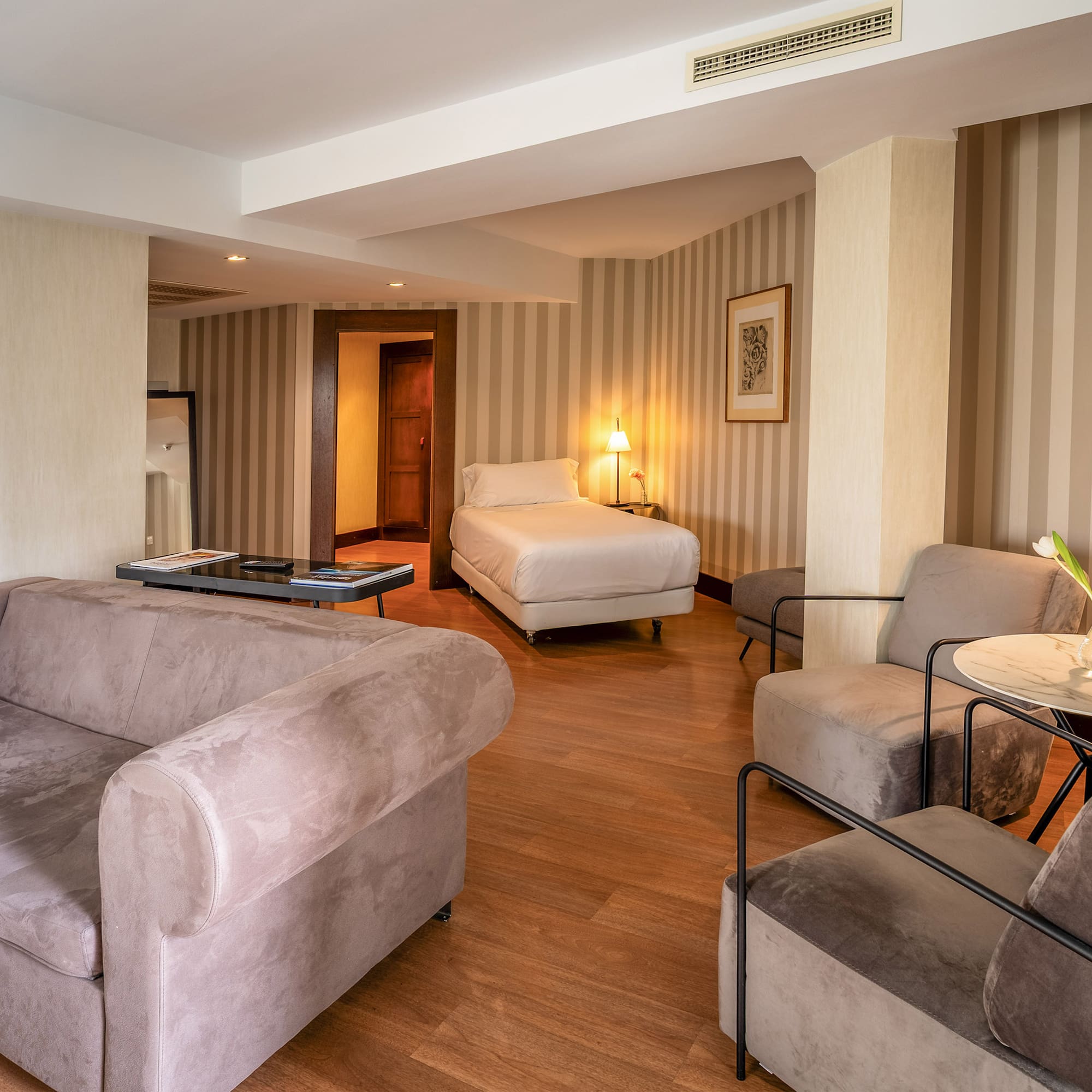 a room with couches and a bed