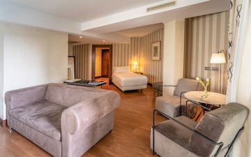 a room with couches and a bed