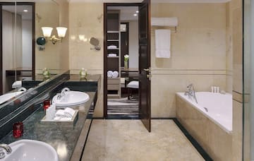 a bathroom with a bathtub and sink
