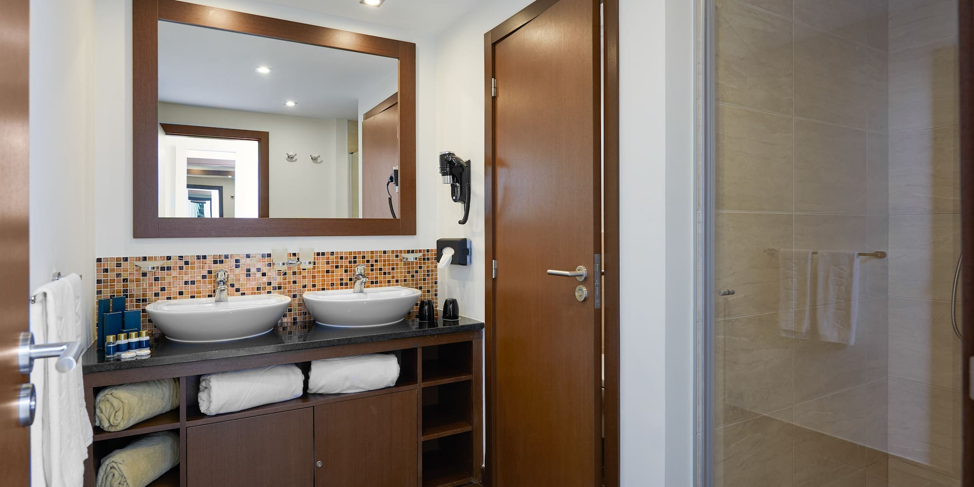 a bathroom with a mirror and sink