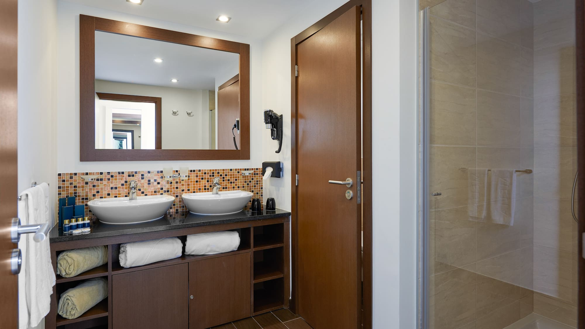 a bathroom with a mirror and sink