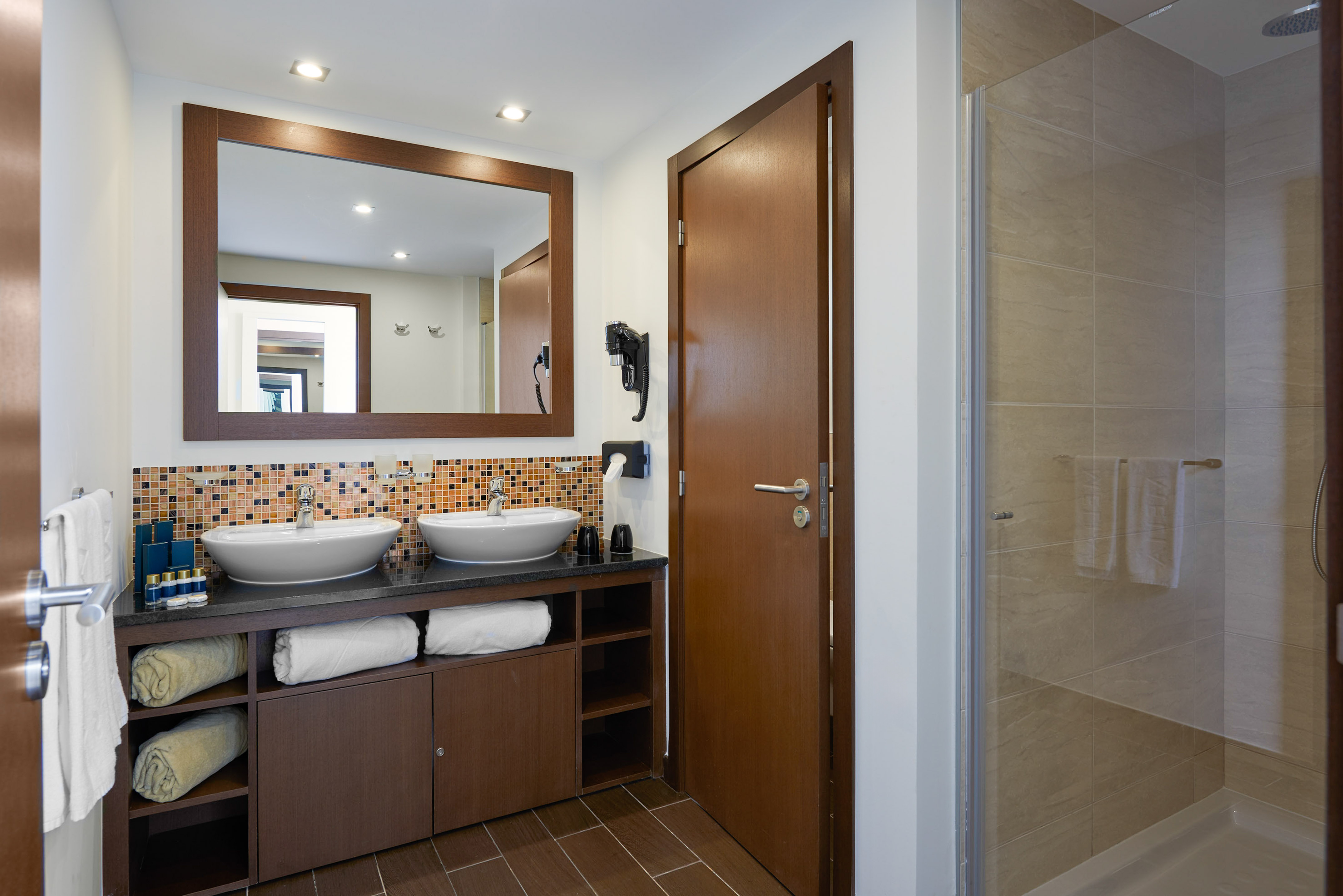 a bathroom with a mirror and sink