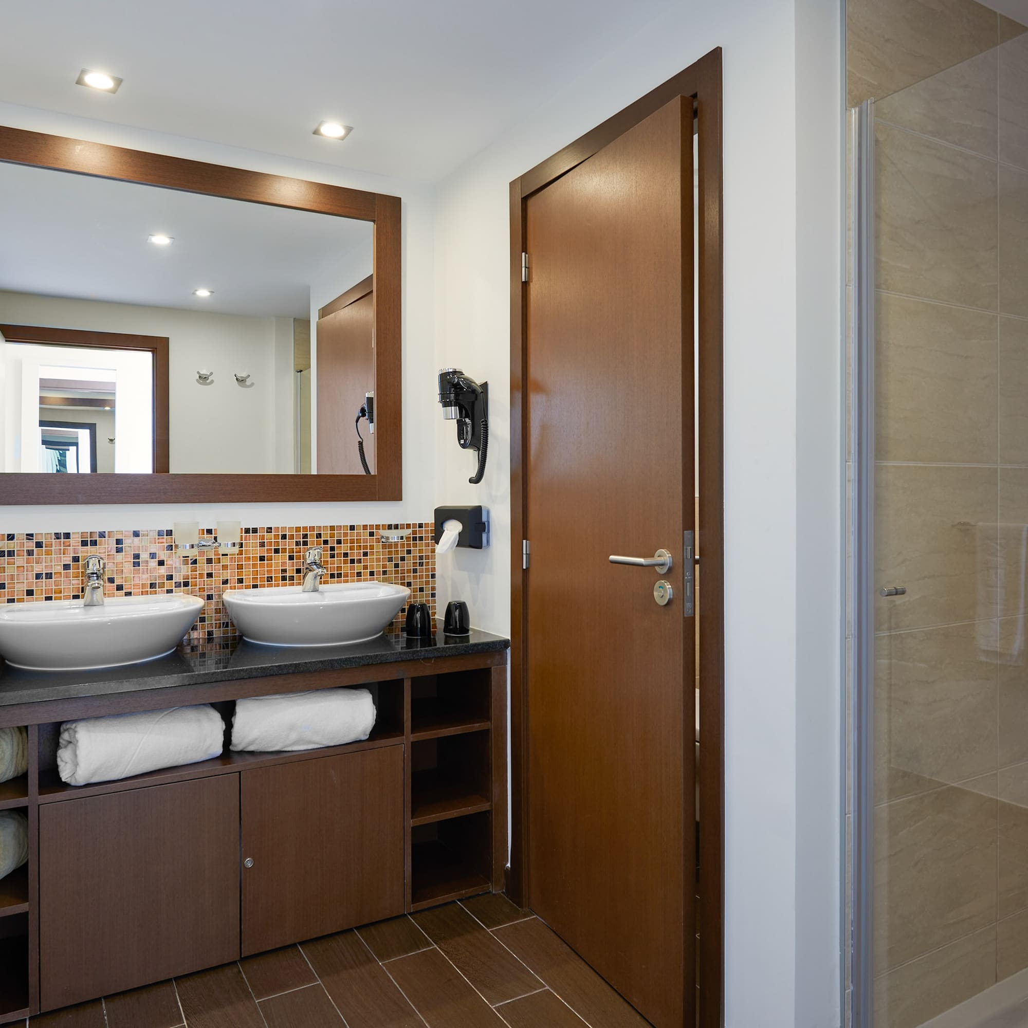 a bathroom with a mirror and sink