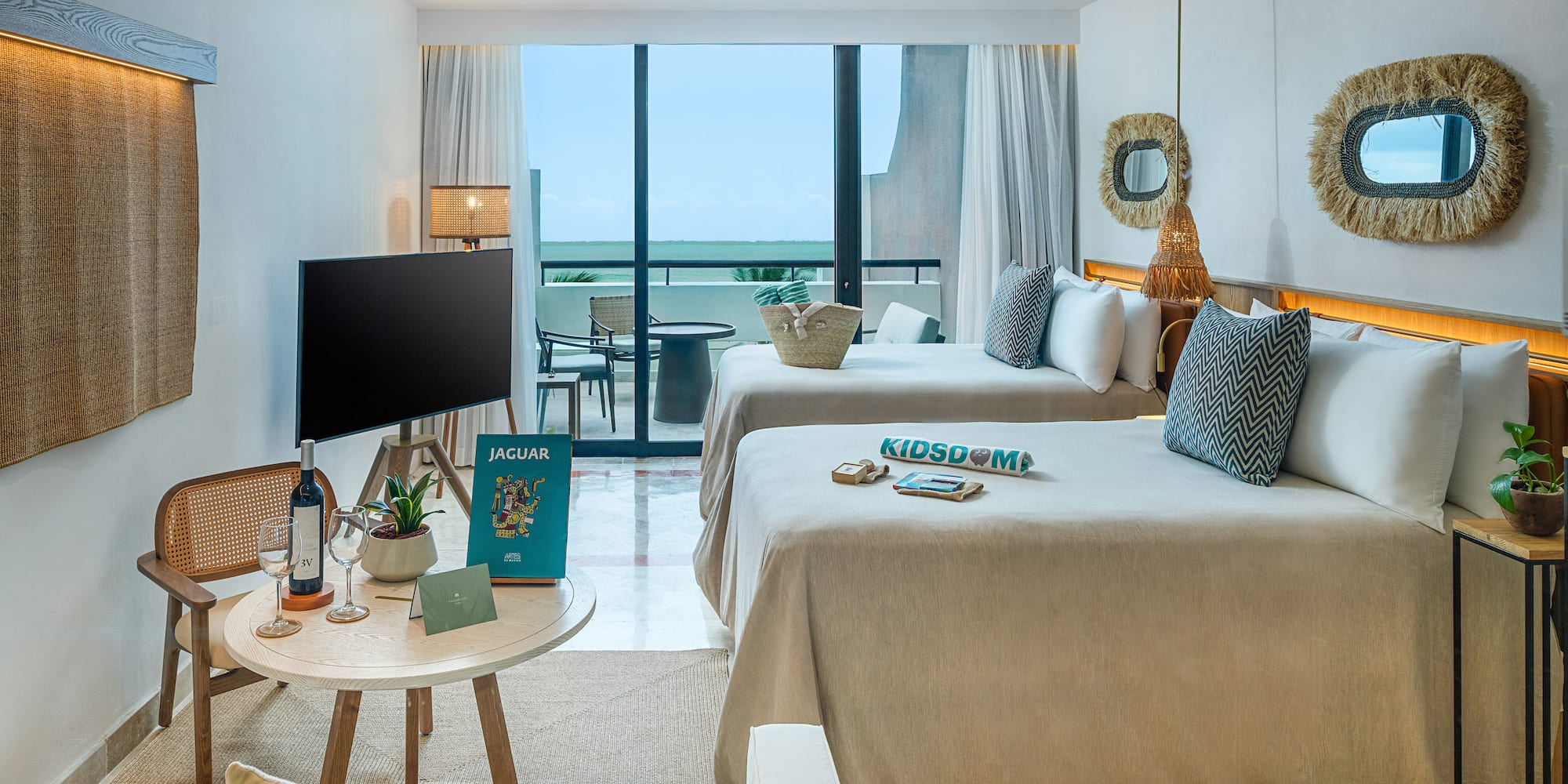 a room with two beds and a television