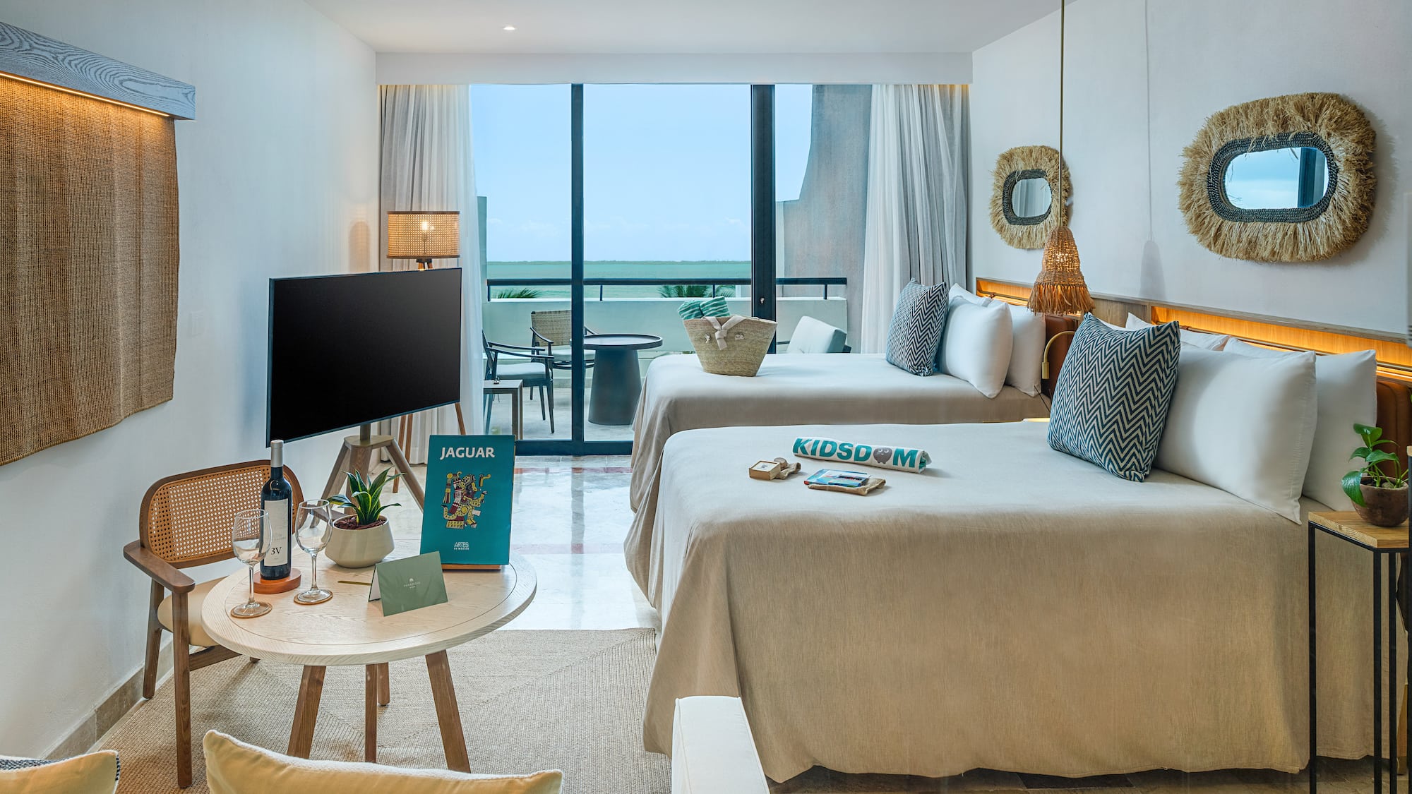 a room with two beds and a television