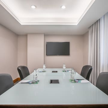 a conference room with a table and chairs