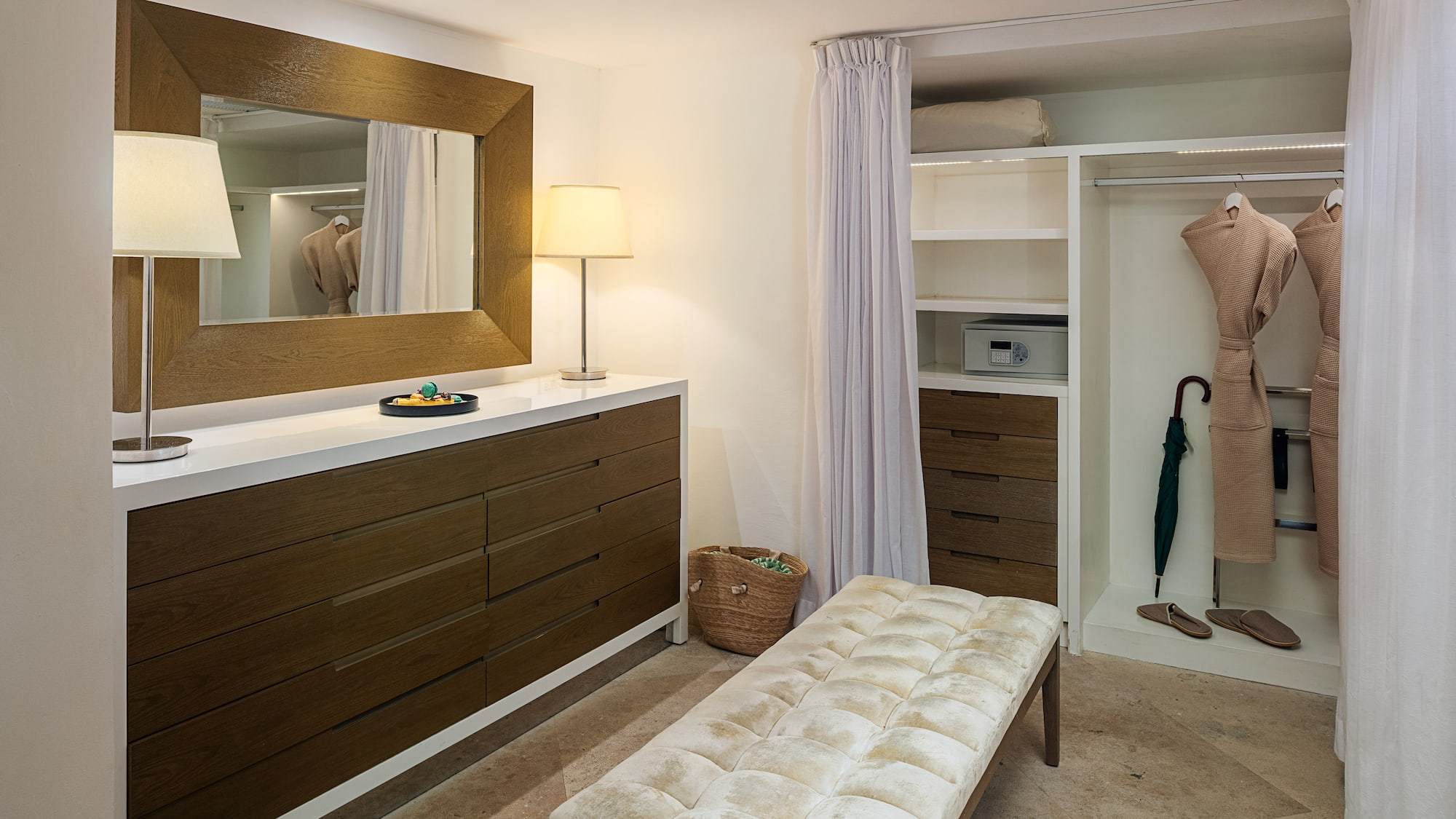 a room with a mirror and dresser