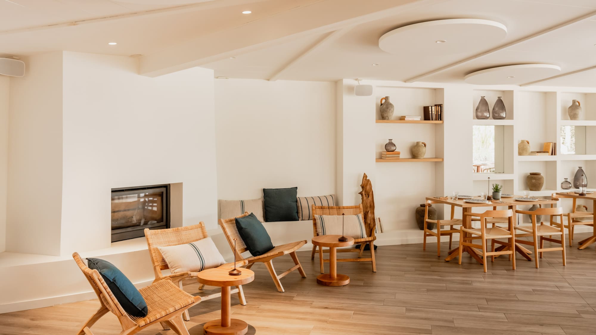 a room with a fireplace and chairs