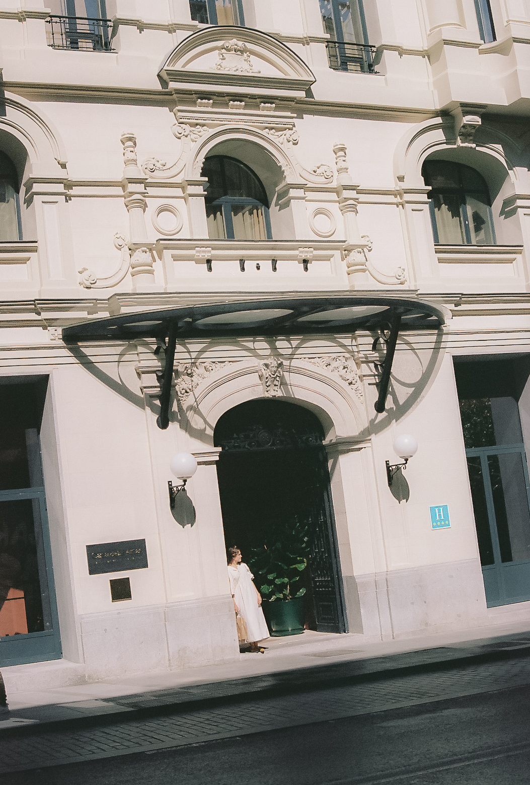 a woman standing in front of a building