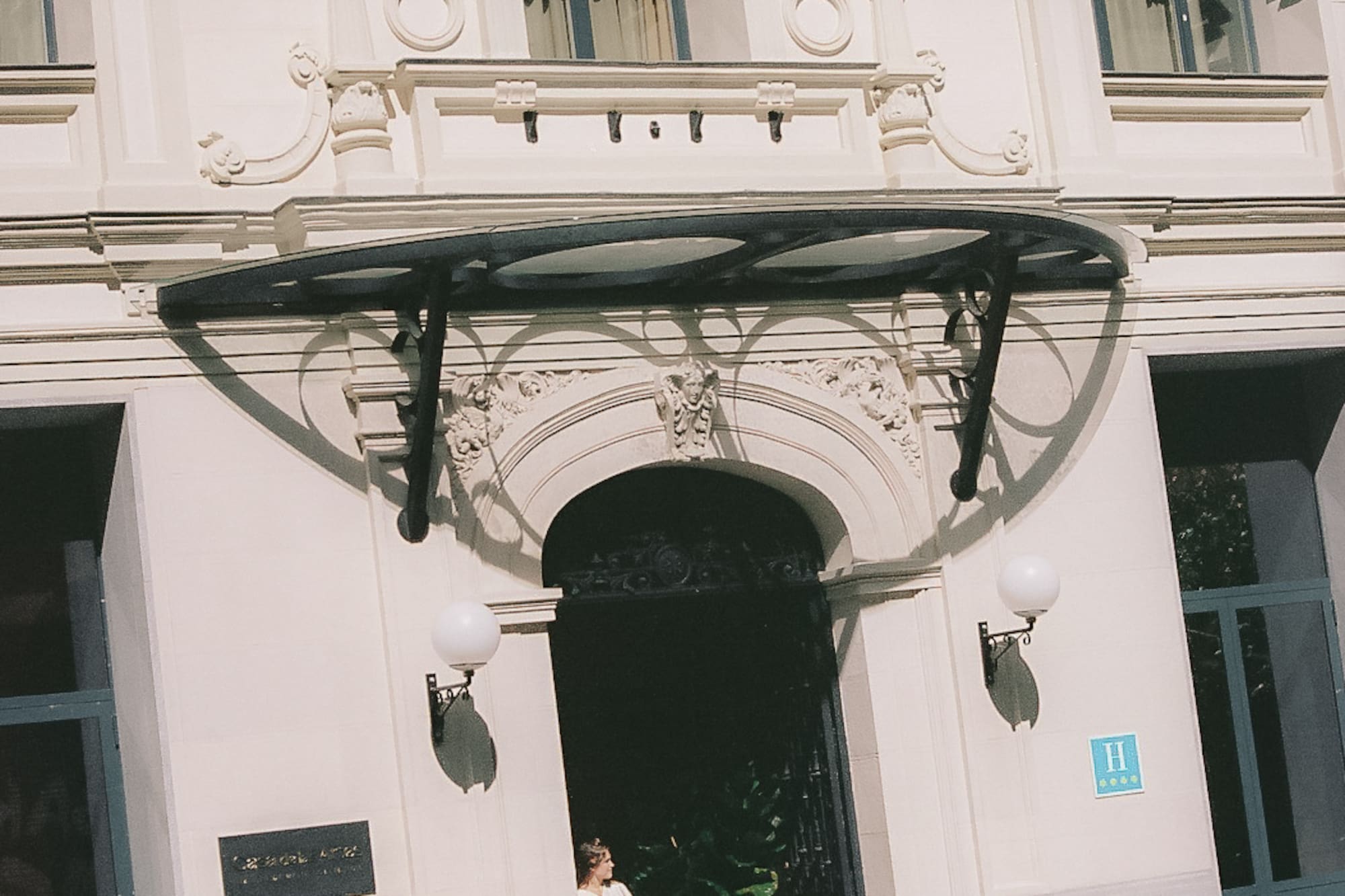 a woman standing in front of a building