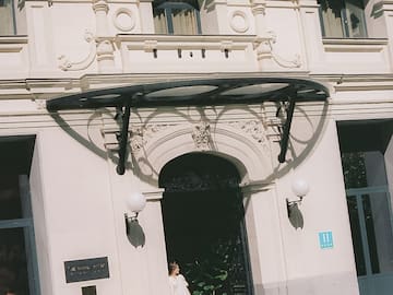 a woman standing in front of a building