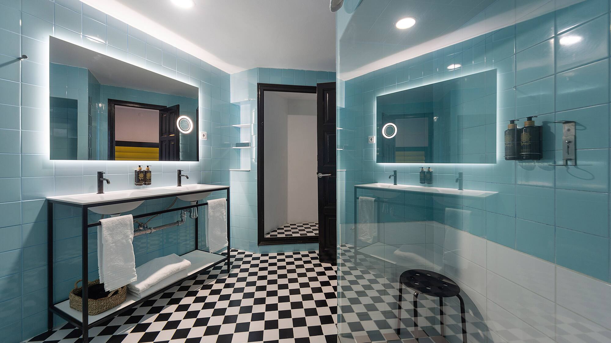 a bathroom with a mirror and a sink