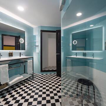 a bathroom with a mirror and a sink