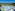 a swimming pool with trees and chairs and a water park