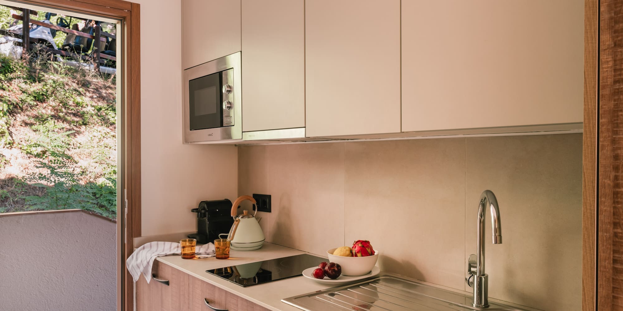 a kitchen with a sink and a microwave