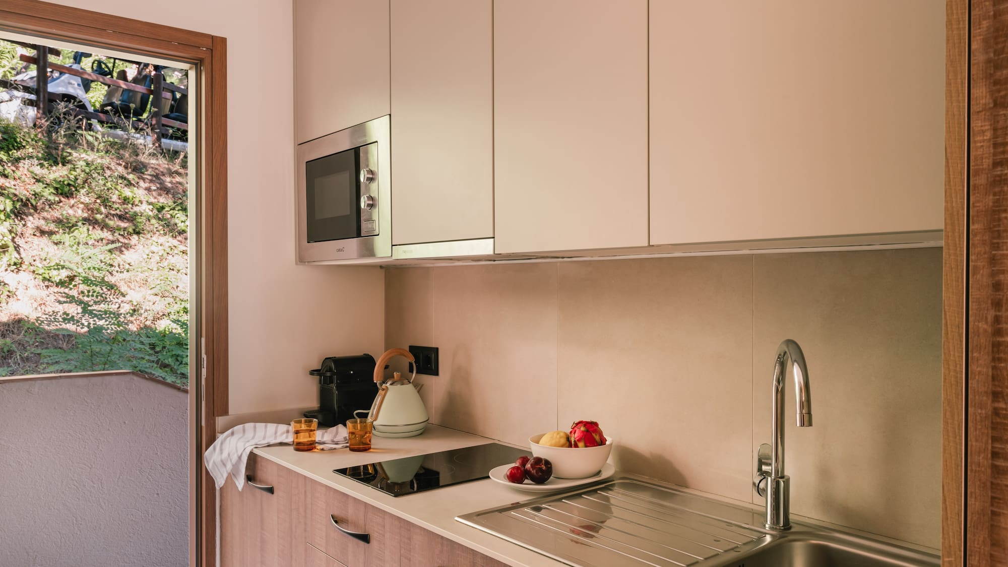 a kitchen with a sink and a microwave