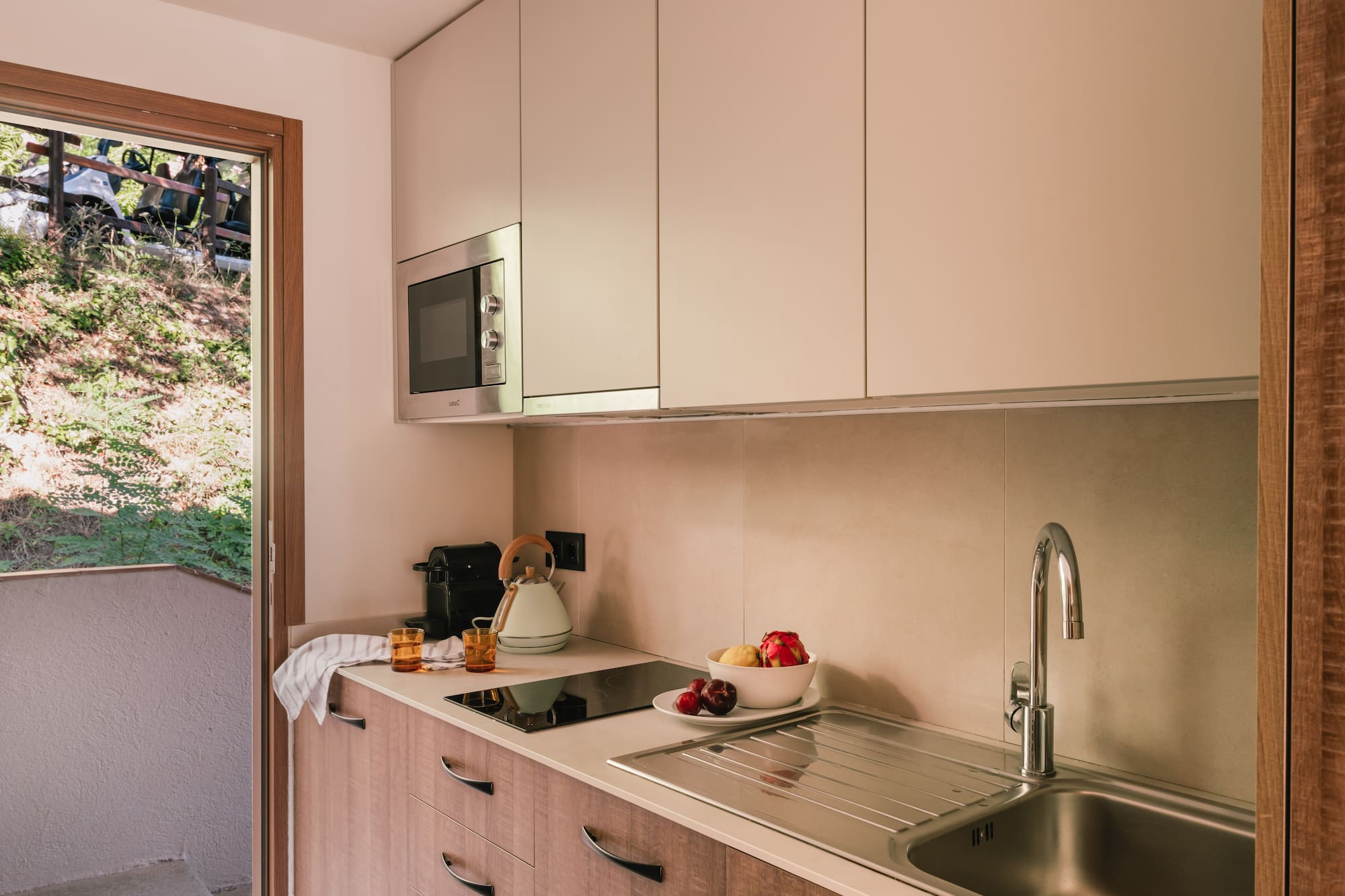 a kitchen with a sink and a microwave
