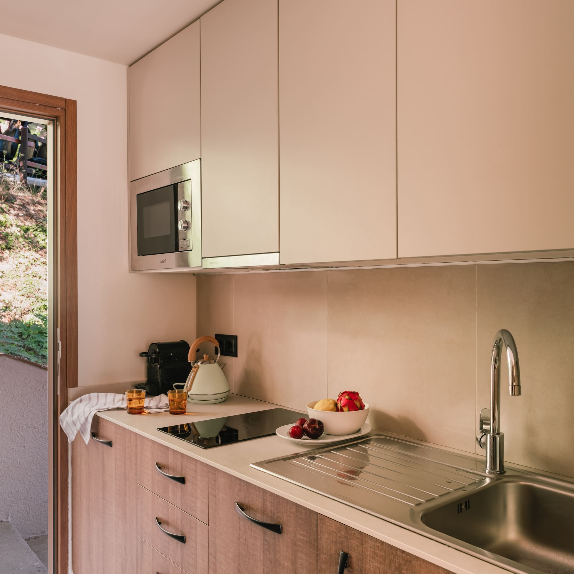 a kitchen with a sink and a microwave