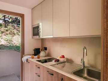 a kitchen with a sink and a microwave