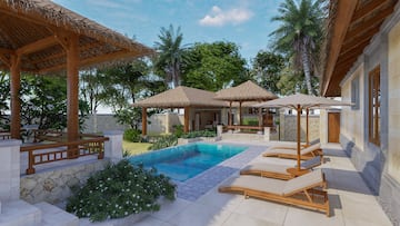 a pool with lounge chairs and umbrellas