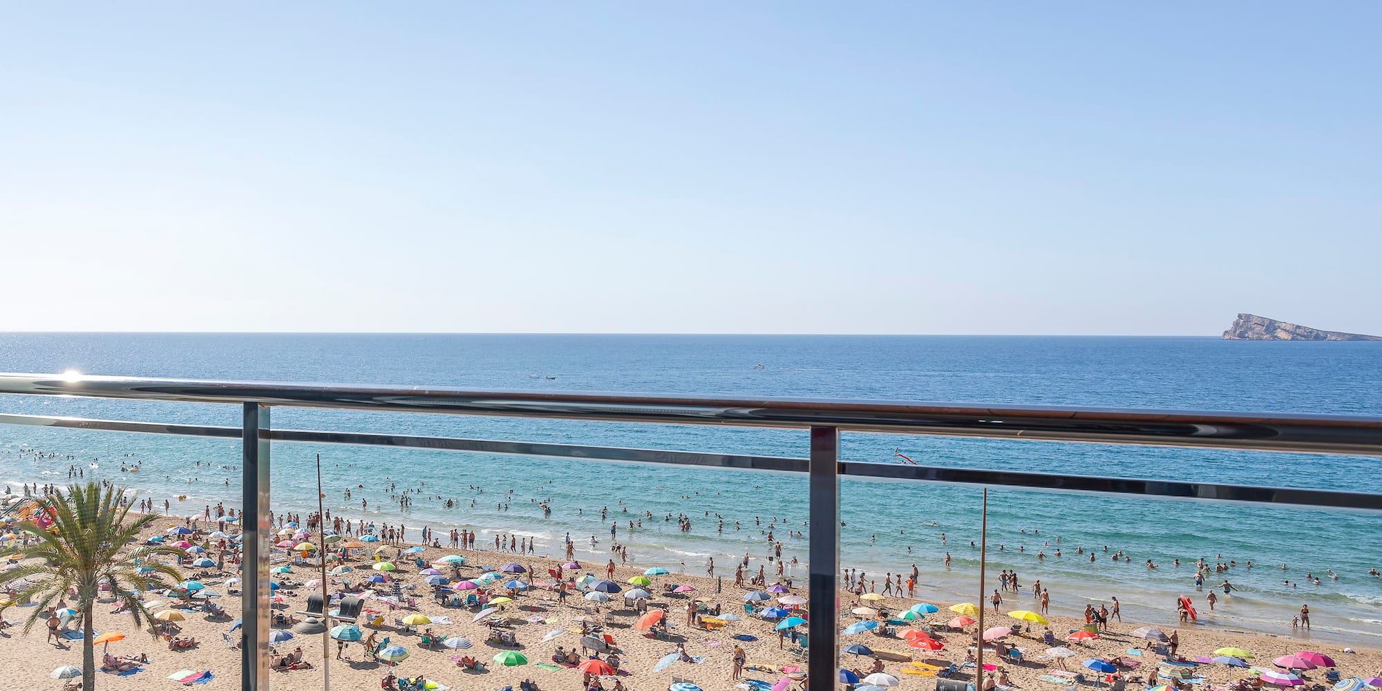 a beach with many people on it