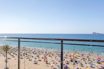 a beach with many people on it